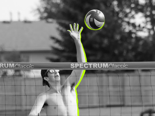 man hitting volleyball