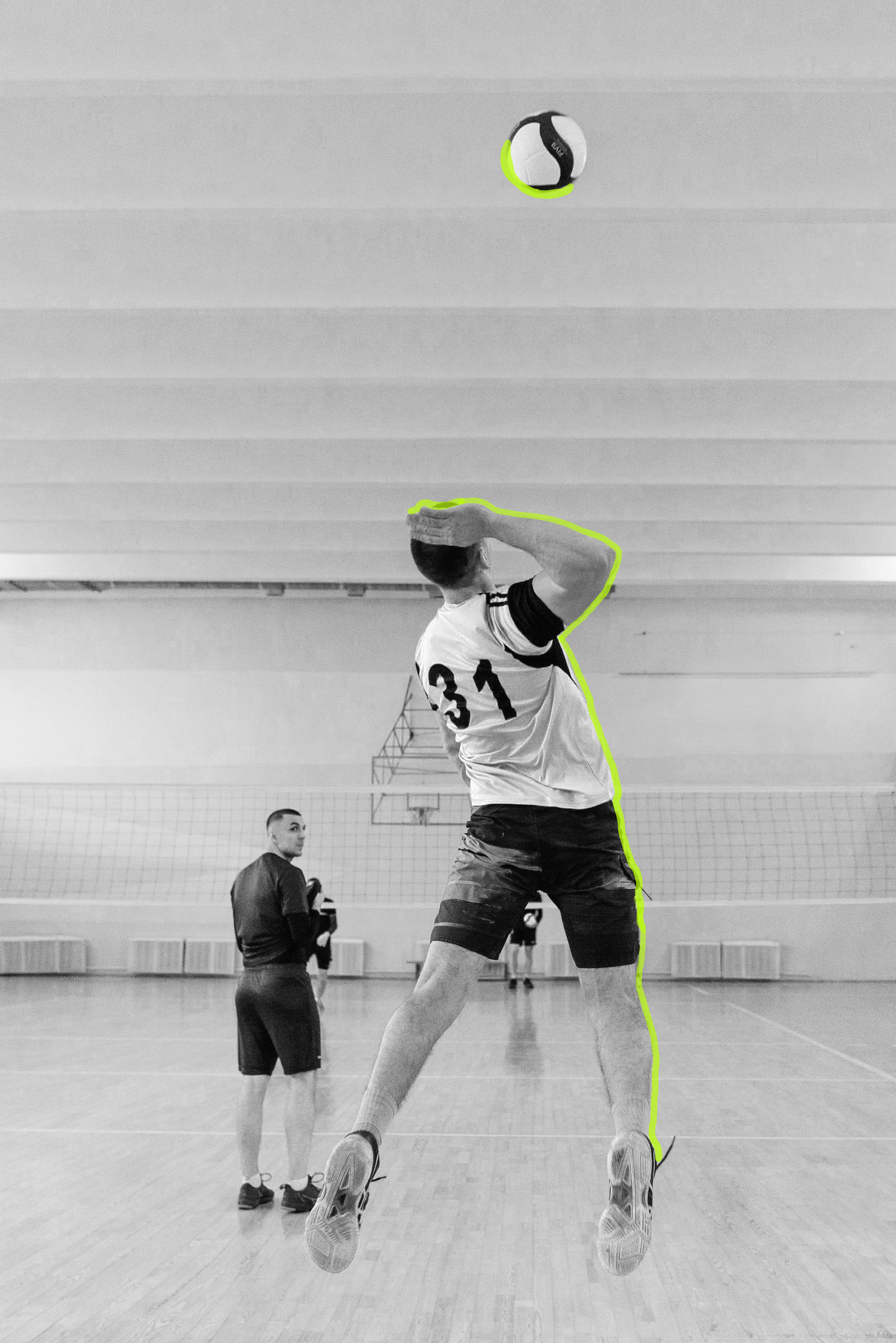 man jumping to hit the volleyball