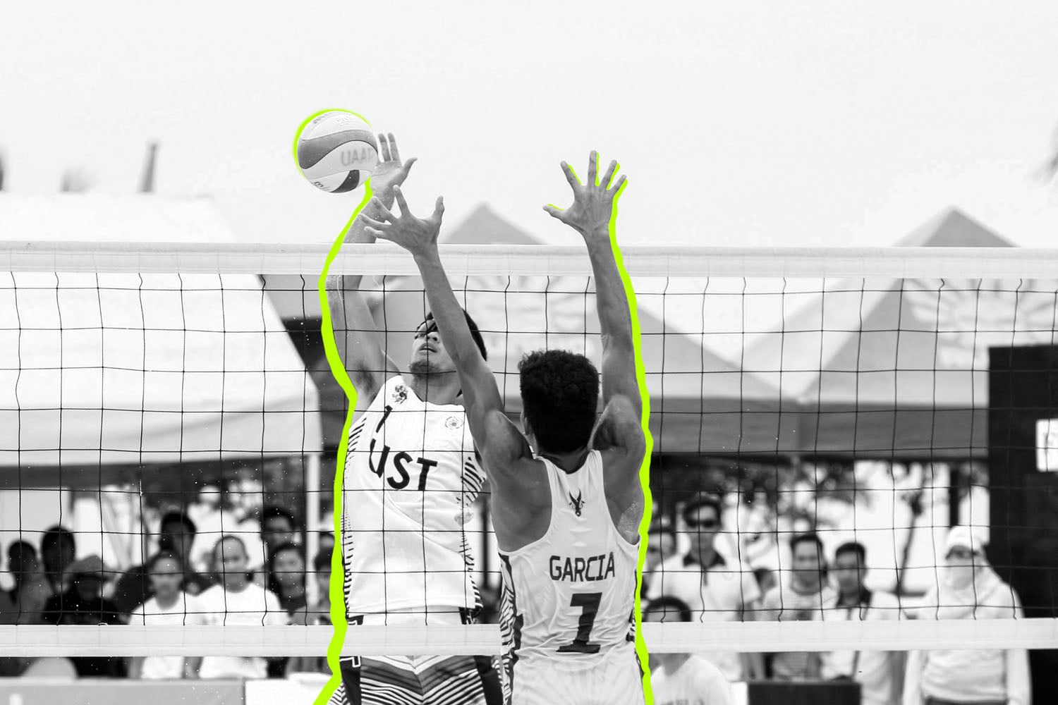 two men jumping to hit volleyball